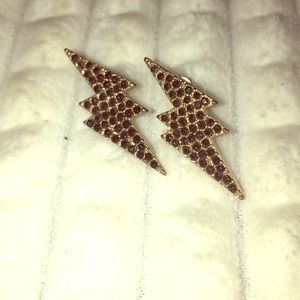 Gold lightning bolt studs with black diamonds. New